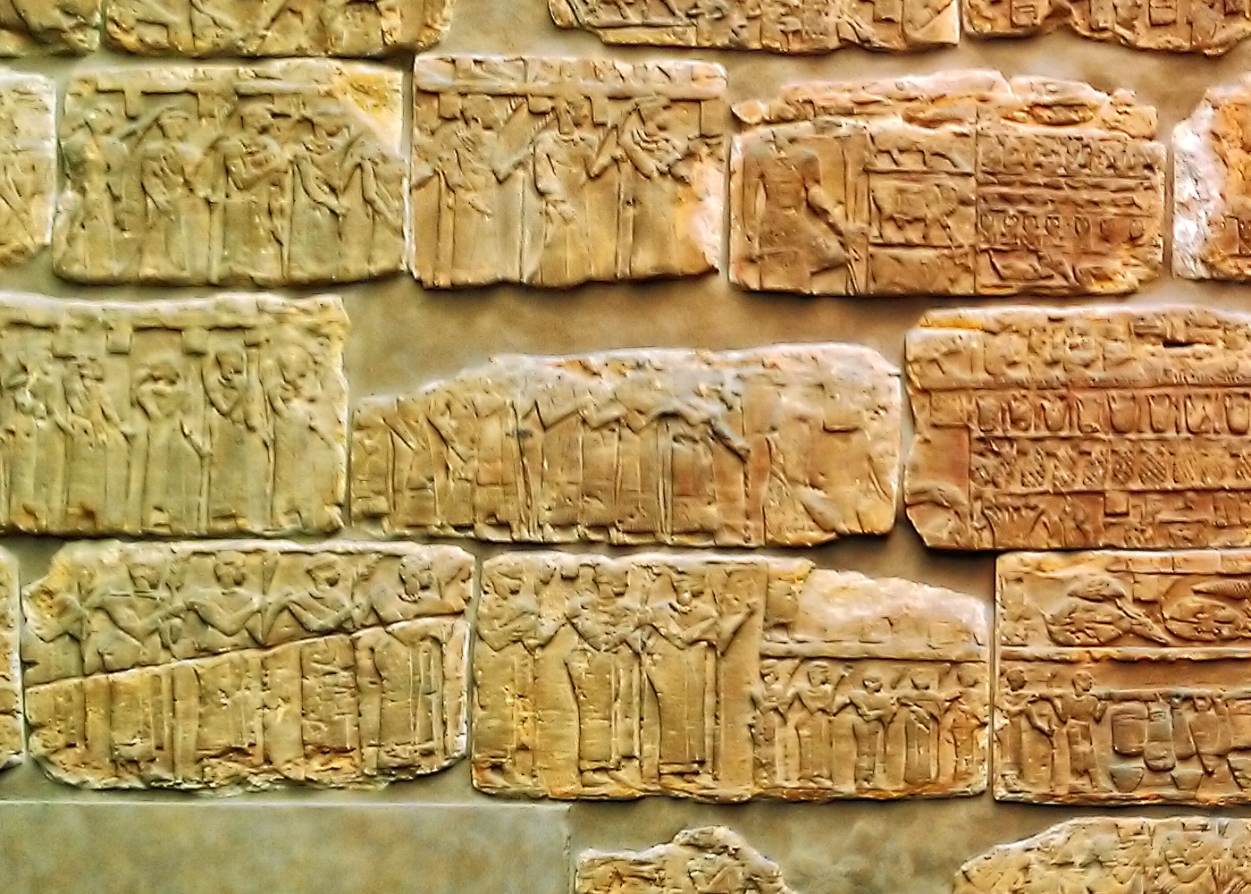 Fragments of a red sandstone relief from the funerary chapel of Queen Shanakdakhete, showing rows of carved human figures in procession